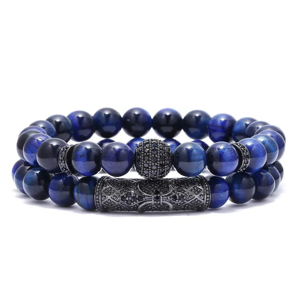 Double strand blue tiger eye bead bracelet with black detailed metal accents on white background
