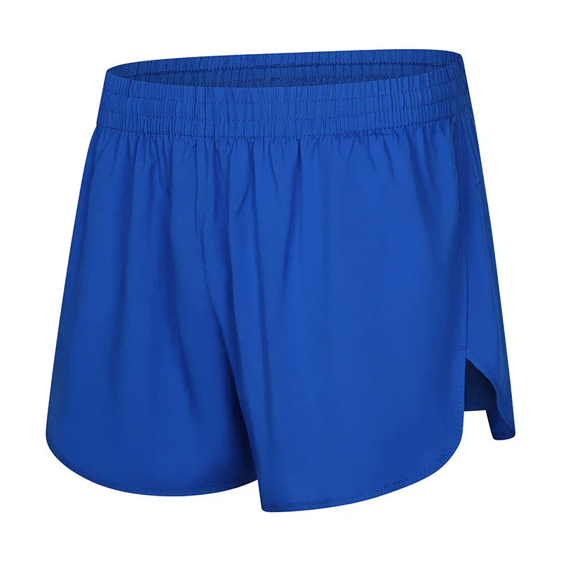 Blue athletic running shorts with elastic waistband and side slits on white background